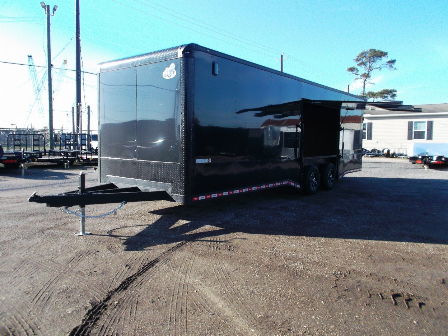 New 2025 COVERED WAGON 8.5x28 Race Trailer / Cargo Trailer / XXL Package / 7'6" Interior Height / Split 7000# Torsion Axles / Heavy Duty Extra Wide Ramp / .080 Black Poly Core / Rear Spoiler w/ LEDS / Side Wall Escape Door / Mag Wheels / Black Out Package