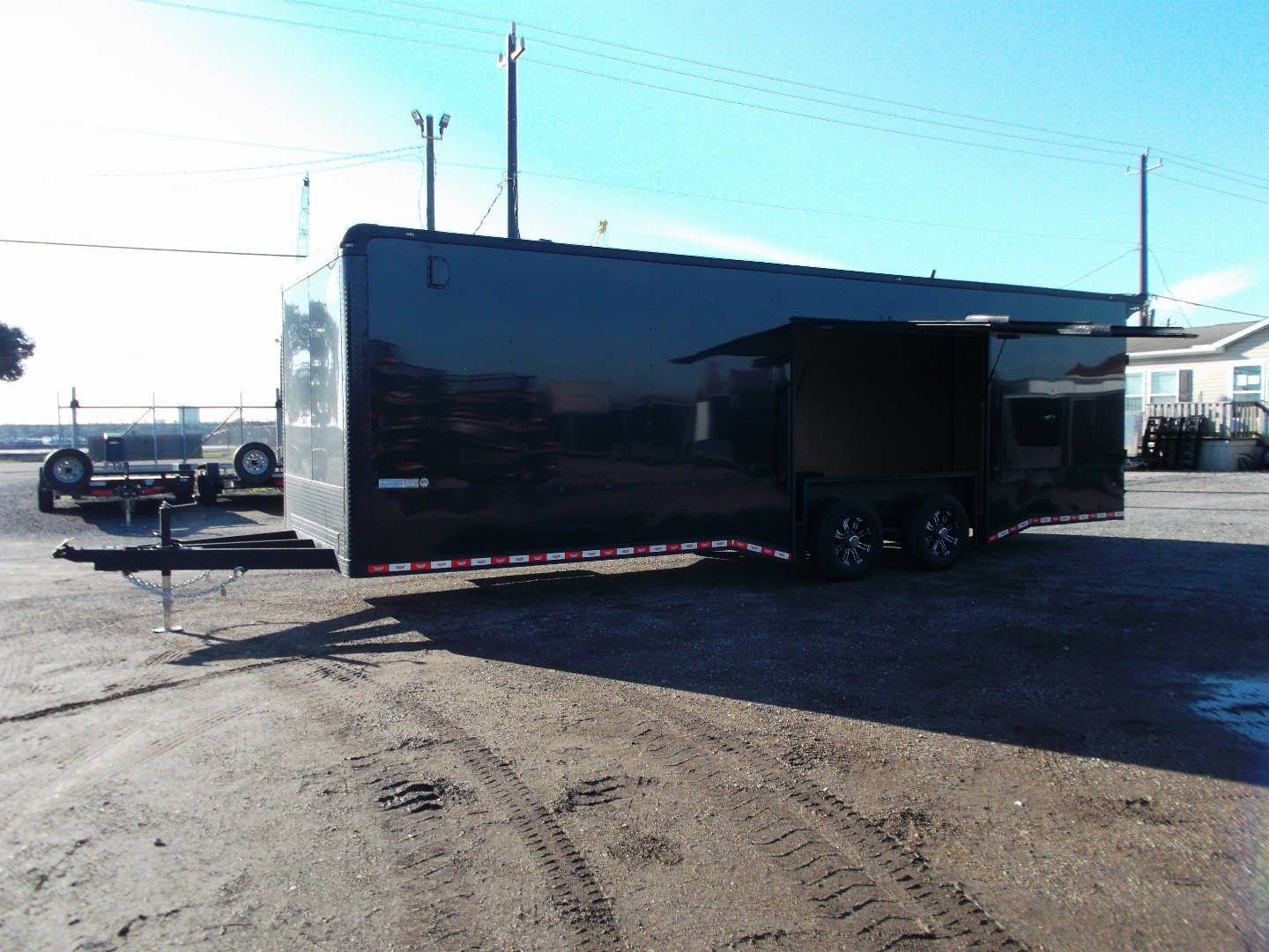 New 2025 COVERED WAGON 8.5x28 Race Trailer / Cargo Trailer / XXL Package / 7'6" Interior Height / Split 7000# Torsion Axles / Heavy Duty Extra Wide Ramp / .080 Black Poly Core / Rear Spoiler w/ LEDS / Side Wall Escape Door / Mag Wheels / Black Out Package