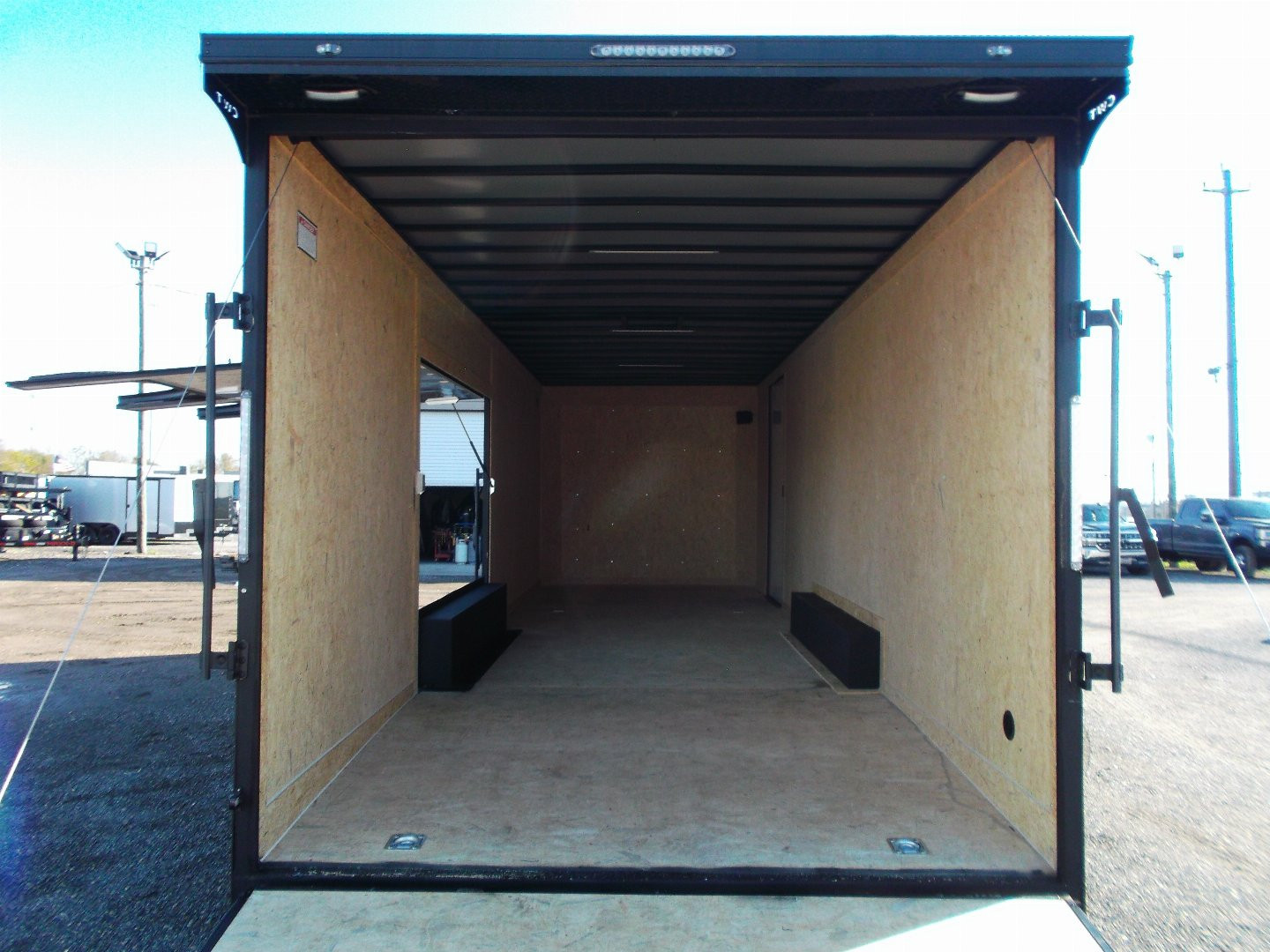 New 2025 COVERED WAGON 8.5x28 Race Trailer / Cargo Trailer / XXL Package / 7'6" Interior Height / Split 7000# Torsion Axles / Heavy Duty Extra Wide Ramp / .080 Black Poly Core / Rear Spoiler w/ LEDS / Side Wall Escape Door / Mag Wheels / Black Out Package