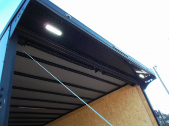 New 2025 COVERED WAGON 8.5x28 Race Trailer / Cargo Trailer / XXL Package / 7'6" Interior Height / Split 7000# Torsion Axles / Heavy Duty Extra Wide Ramp / .080 Black Poly Core / Rear Spoiler w/ LEDS / Side Wall Escape Door / Mag Wheels / Black Out Package