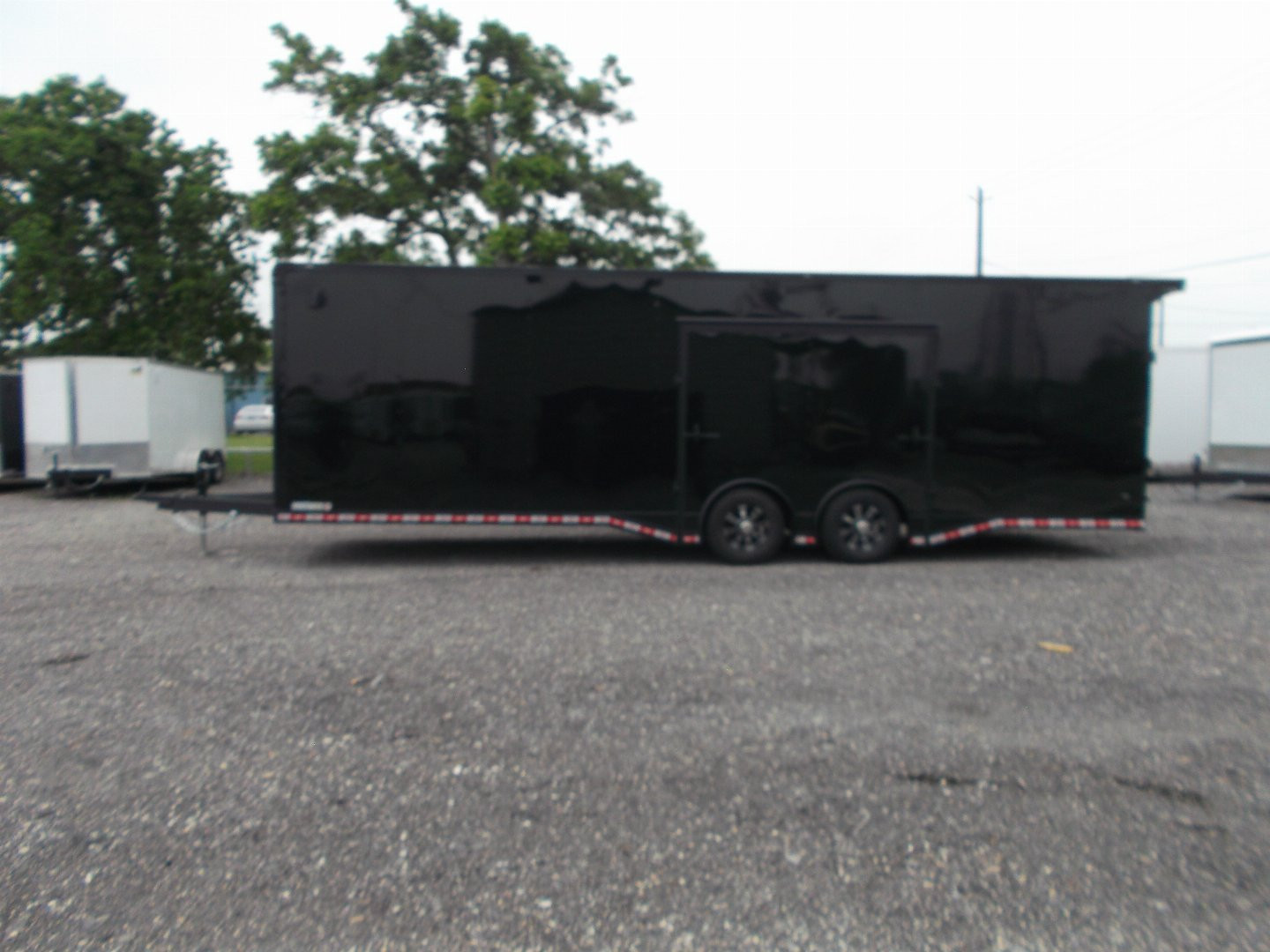 New 2025 COVERED WAGON TRAILERS 8.5x28 Race Trailer / Cargo Trailer / XXL Package / 7'6" Interior Height / Split 7000# Torsion Axles / Heavy Duty Extra Wide Ramp / .080 Black Poly Core / Black Out Package