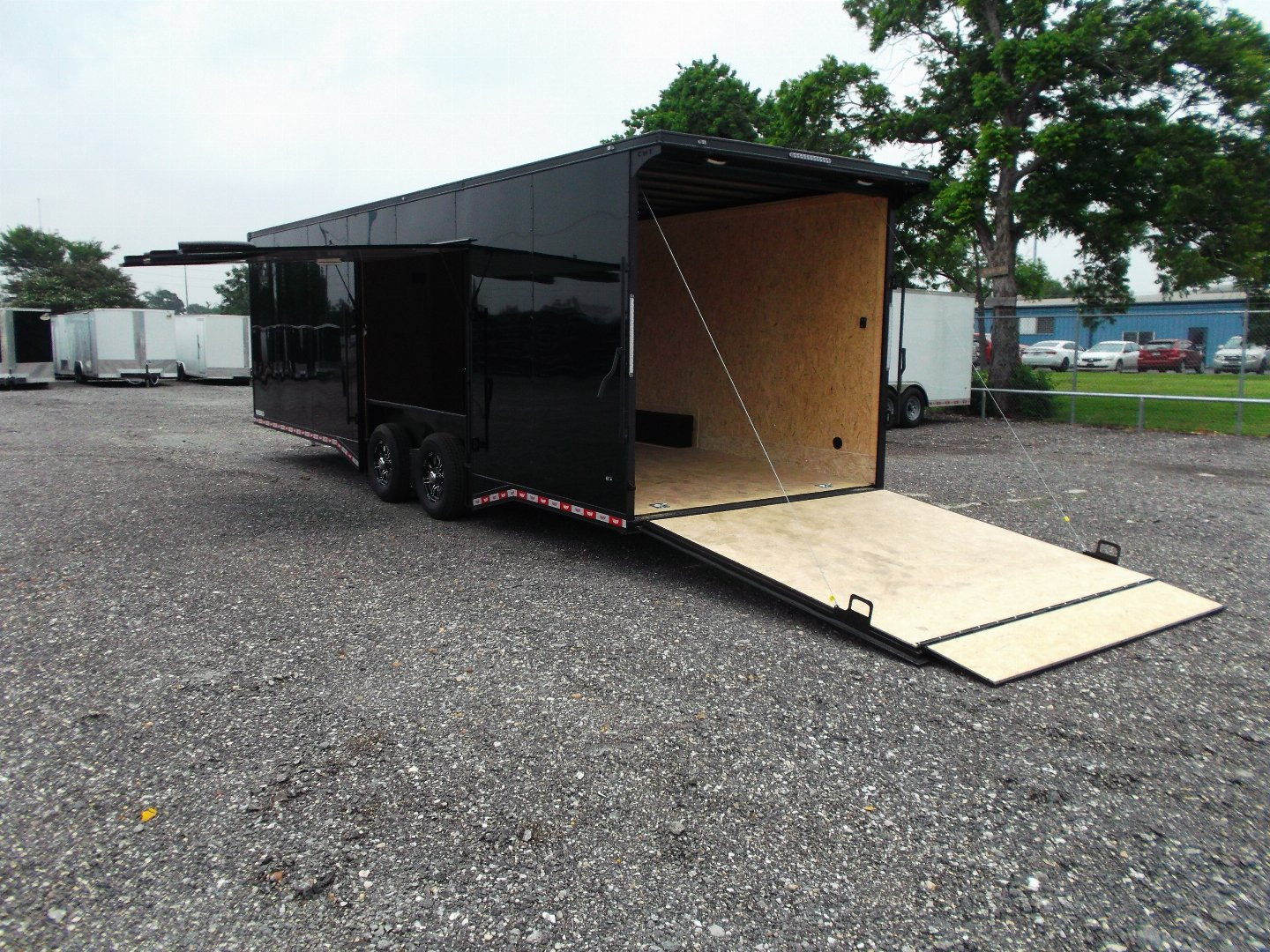 New 2025 COVERED WAGON TRAILERS 8.5x28 Race Trailer / Cargo Trailer / XXL Package / 7'6" Interior Height / Split 7000# Torsion Axles / Heavy Duty Extra Wide Ramp / .080 Black Poly Core / Black Out Package