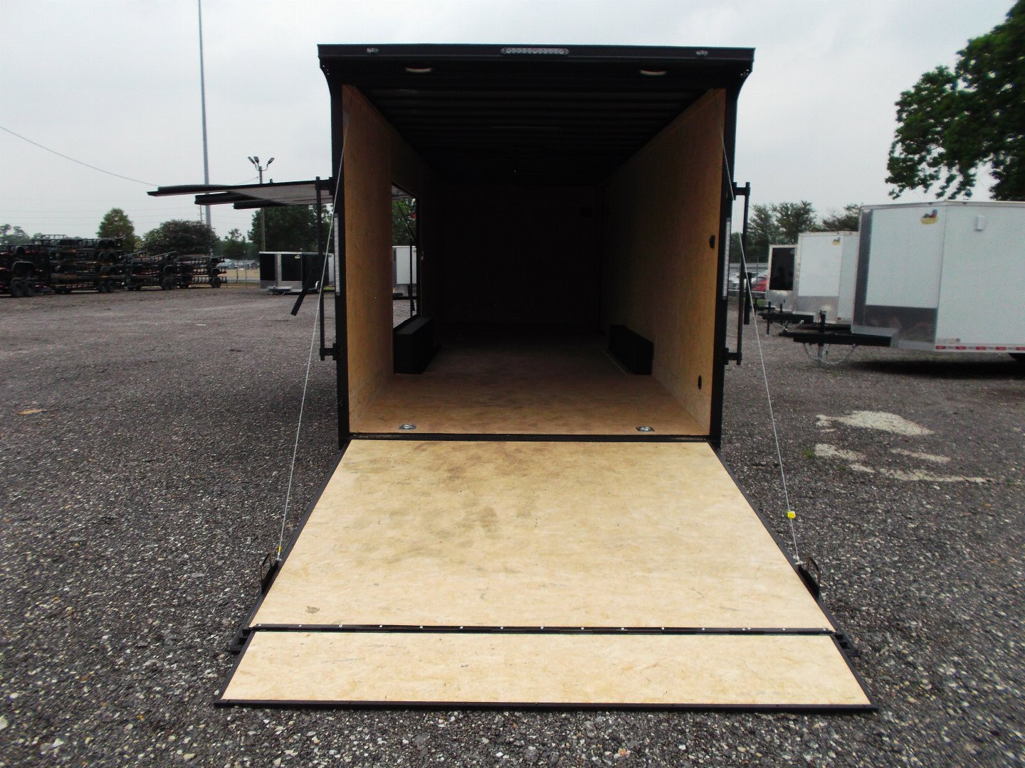 New 2025 COVERED WAGON TRAILERS 8.5x28 Race Trailer / Cargo Trailer / XXL Package / 7'6" Interior Height / Split 7000# Torsion Axles / Heavy Duty Extra Wide Ramp / .080 Black Poly Core / Black Out Package