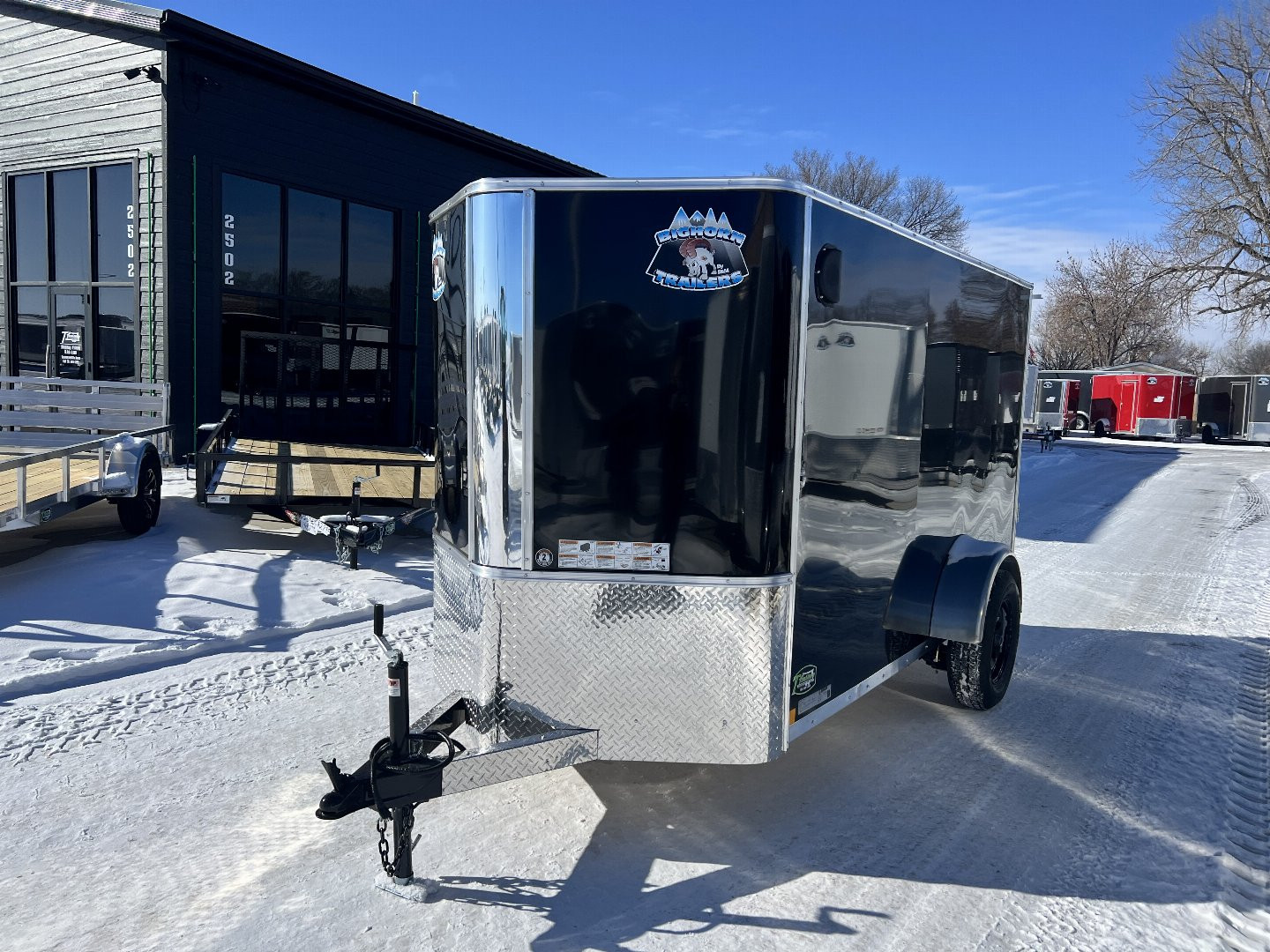 New 2025 R&M (Bighorn) 5x10  +2’V Nose Rear Ramp Enclosed Cargo