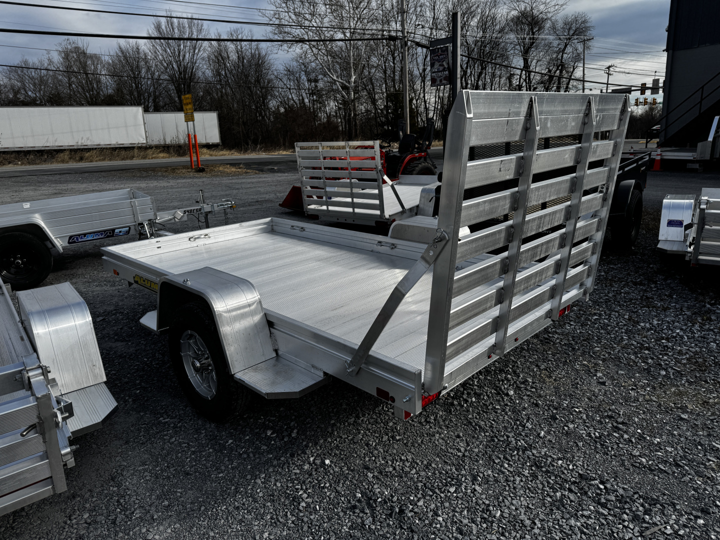New 2027 Aluma 6310H-S-BT One Piece Gate Utility Trailer