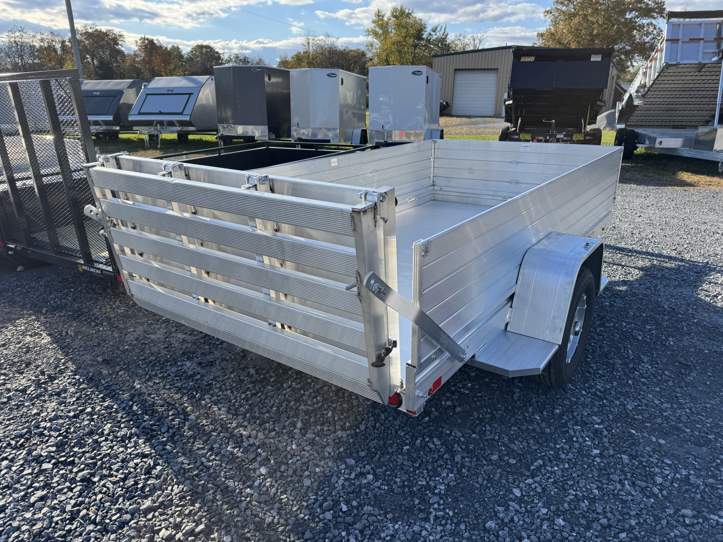 New 2026 Aluma 6310S-BT 2ft Solid Sides Bifold Gate Utility Trailer