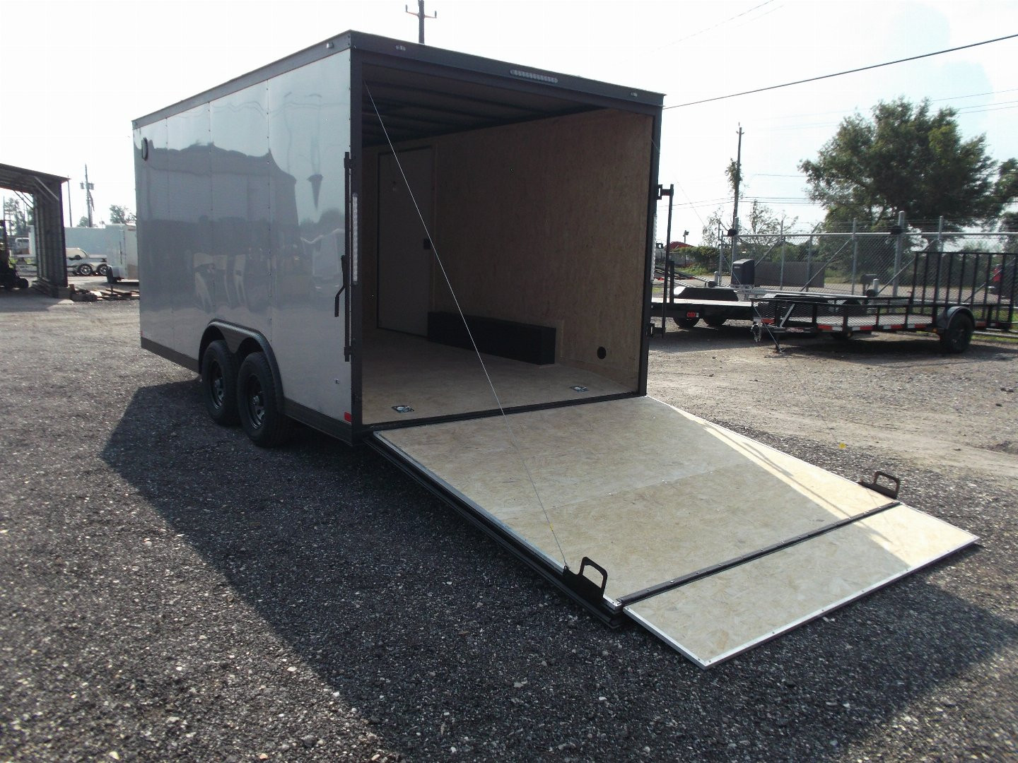 New 2025 COVERED WAGON TRAILERS 8.5x16 Cargo Trailer / Car Hauler / 5200# Axles / 7ft Interior Height / 48" RV Side Door / Bed Lined RV Step / .030 Silver Semi-Screwless Exterior / 60" Triple Tube Tongue / Extra Wide Ramp / Black Out Package