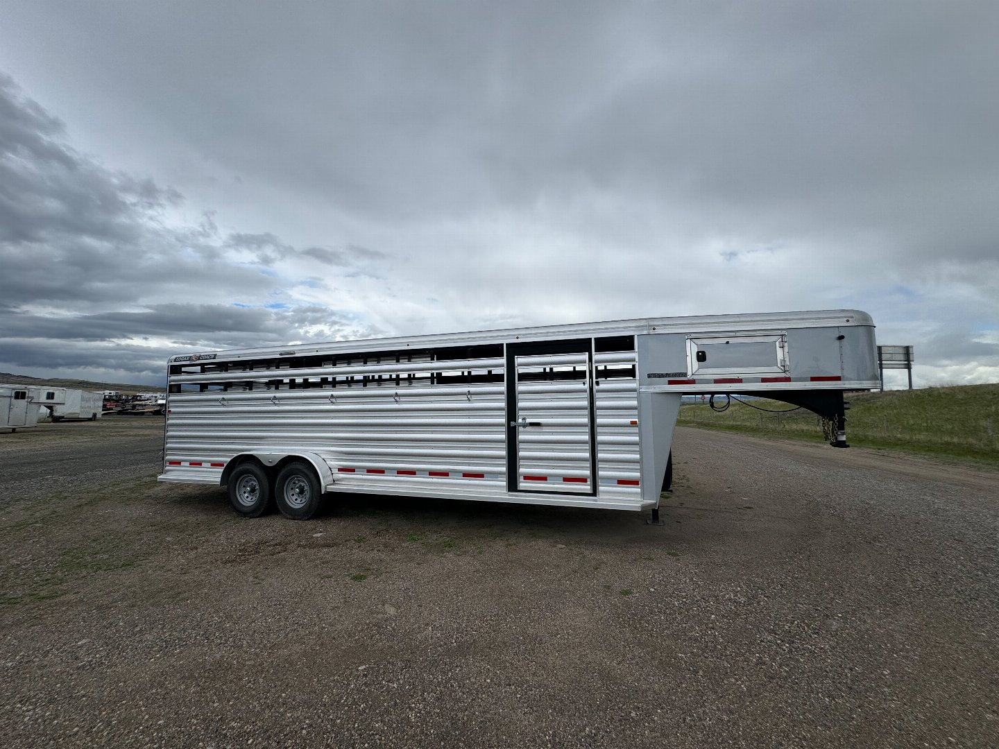 New 2024 Logan Coach Cattleman 24' Stock Trailer