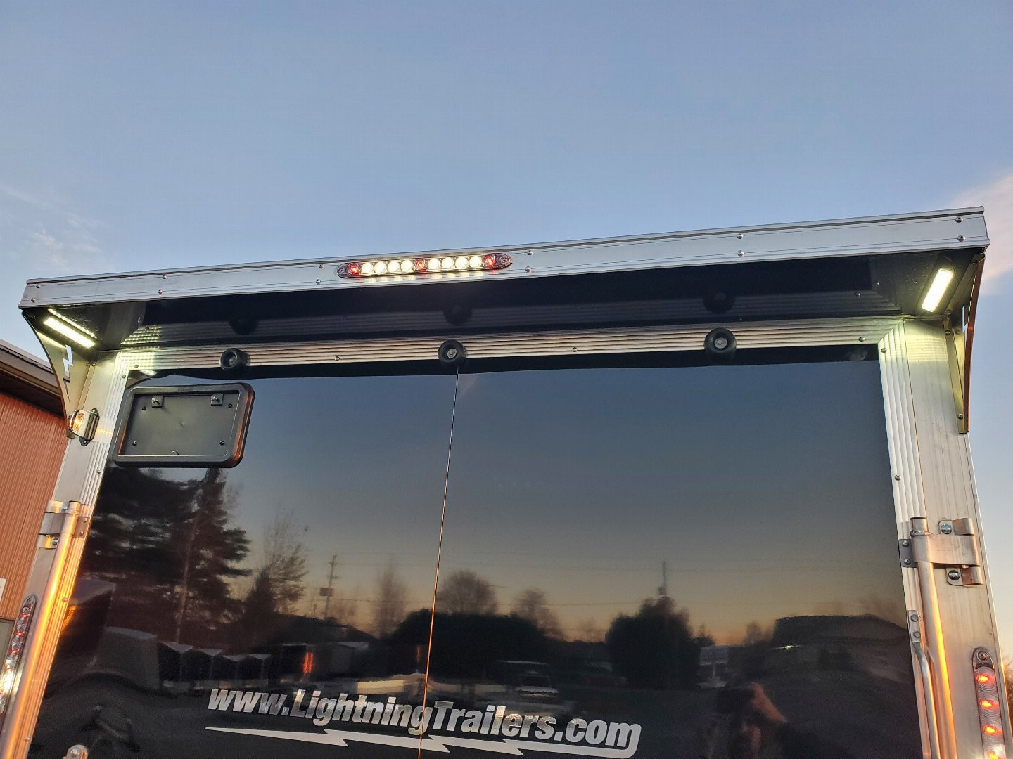 New 2025 LIGHTNING TRAILERS 7'x23' Inline Snowmobile Trailer