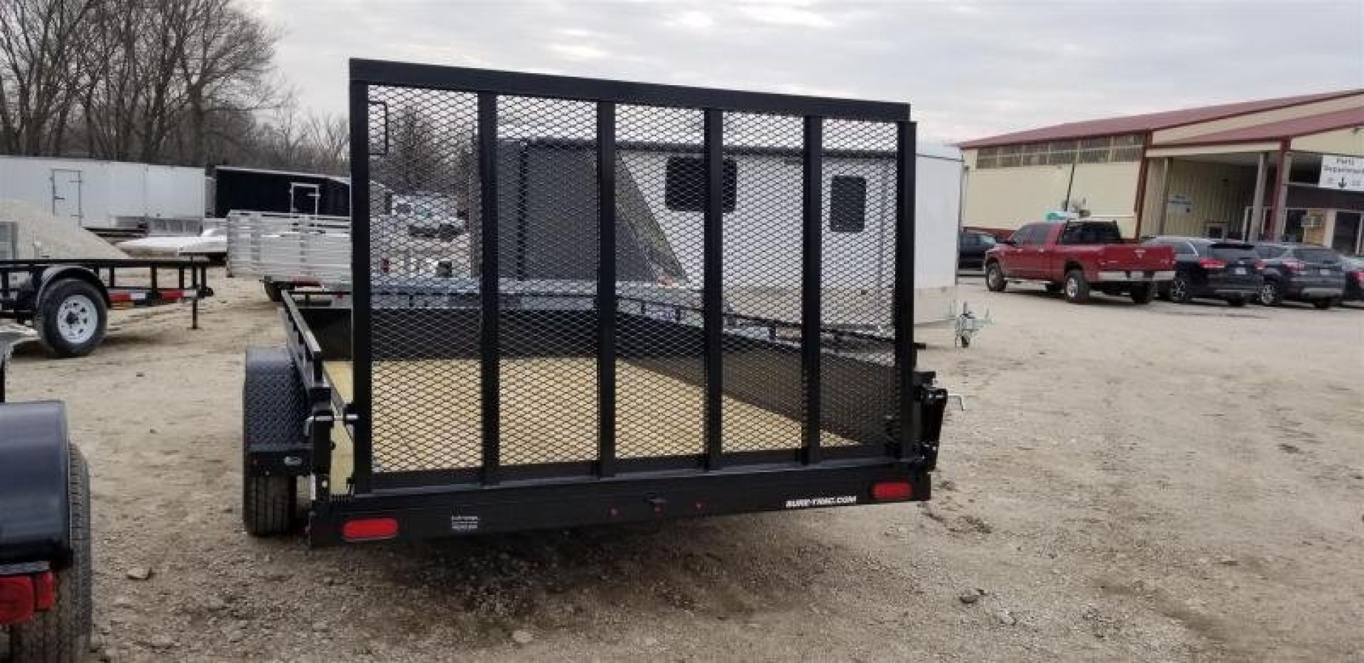 New 2026 Sure-Trac 7x12 Steel High Sided Utility Trailer w/Spring Assisted Gate