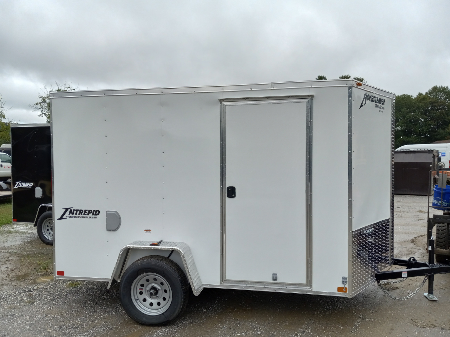 New 2026 Homesteader Trailer / 610IS Cargo / Enclosed Trailer / 6'6" Interior Height / White in color / Side Door and Ramp Rear Door