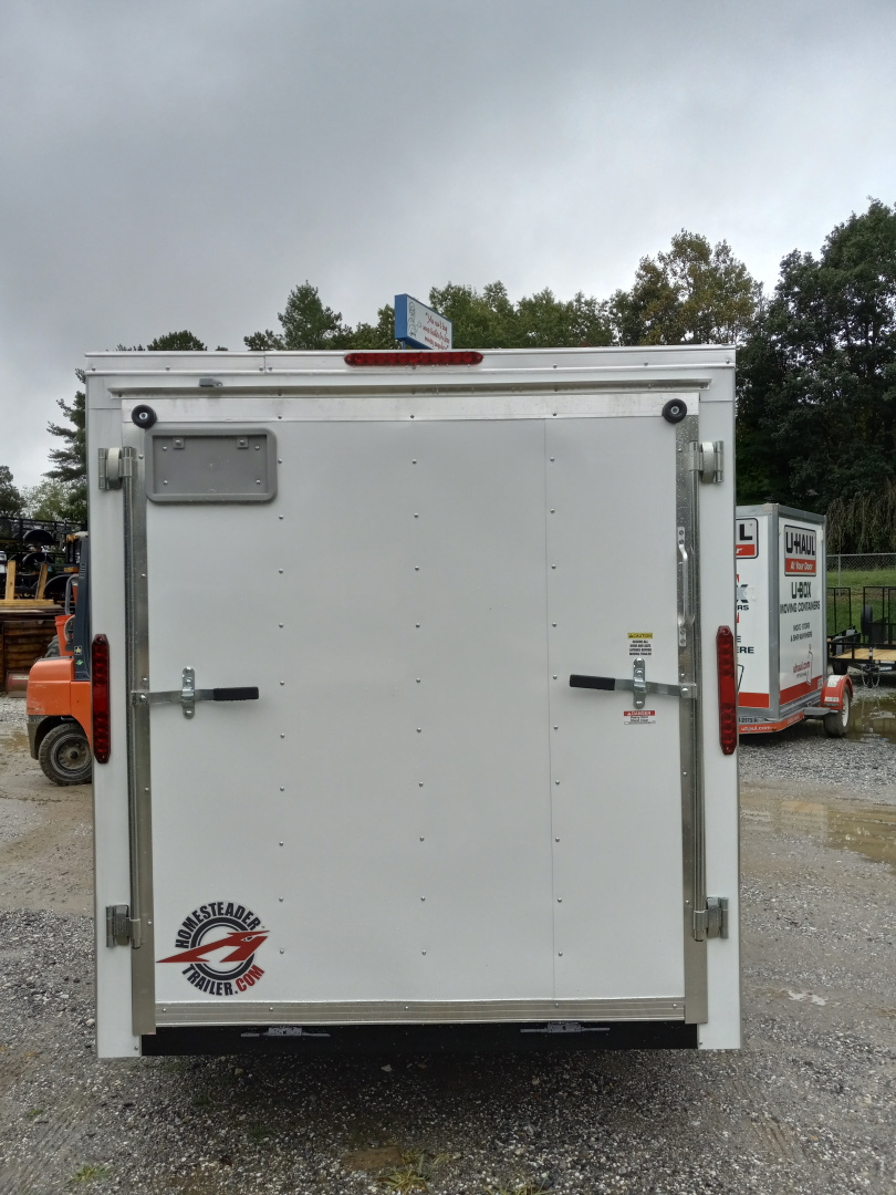 New 2026 Homesteader Trailer / 610IS Cargo / Enclosed Trailer / 6'6" Interior Height / White in color / Side Door and Ramp Rear Door