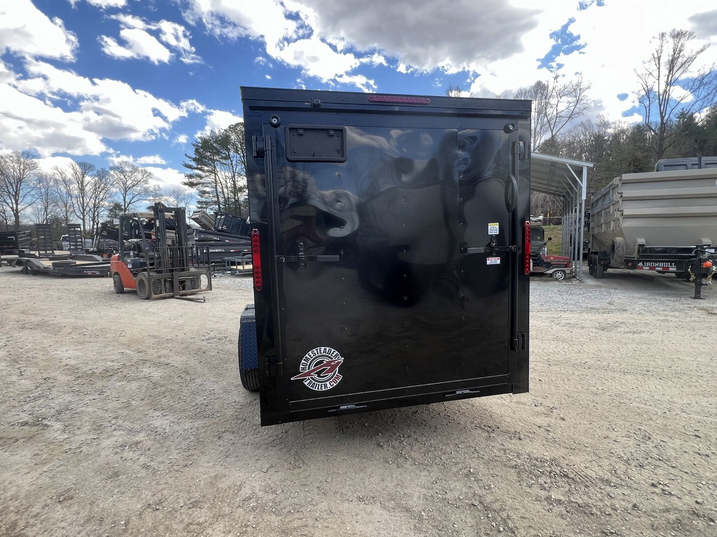 New 2025 Homesteader Trailer / 612IS / 6' wide x 12' Long / 32" Side Door / Ramp Rear Door / 6' Interior Height / .030 Black Aluminum w/ Black Out Pkg