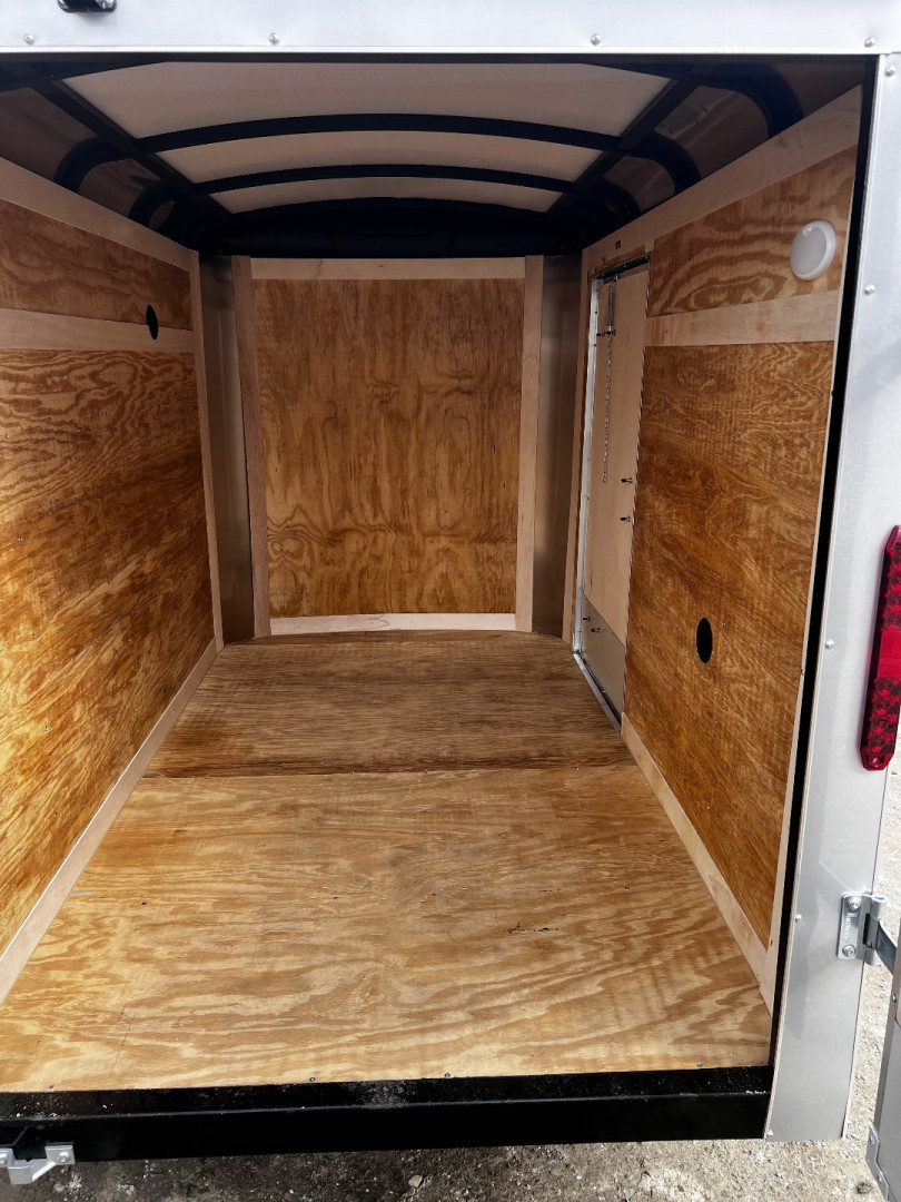 New 2025 Homesteader Trailer / Challenger Series / 5x8 / 5'7" Interior Height / Single Swing Rear Door / 32" Side Door / 24" Stoneguard / .030 Silver Aluminum