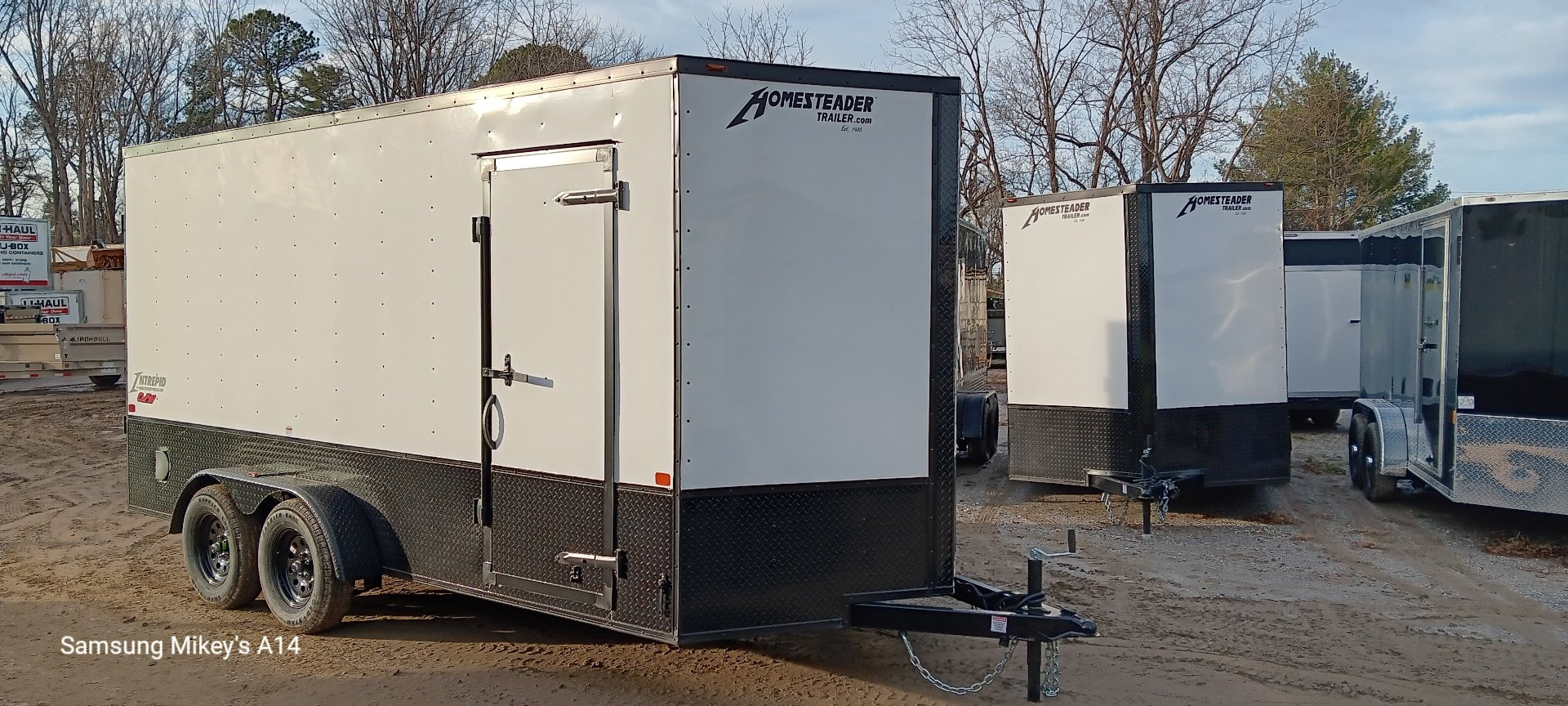 New 2025 Homesteader Trailers / 716IT Intrepid OHV / 7' Interior Height / .030 White Aluminum w/ Black Out Pkg / Ramp Rear Door / 32" Side Door / 4-Recessed Floor D-Rings / ATP 24" High on sides and ramp door