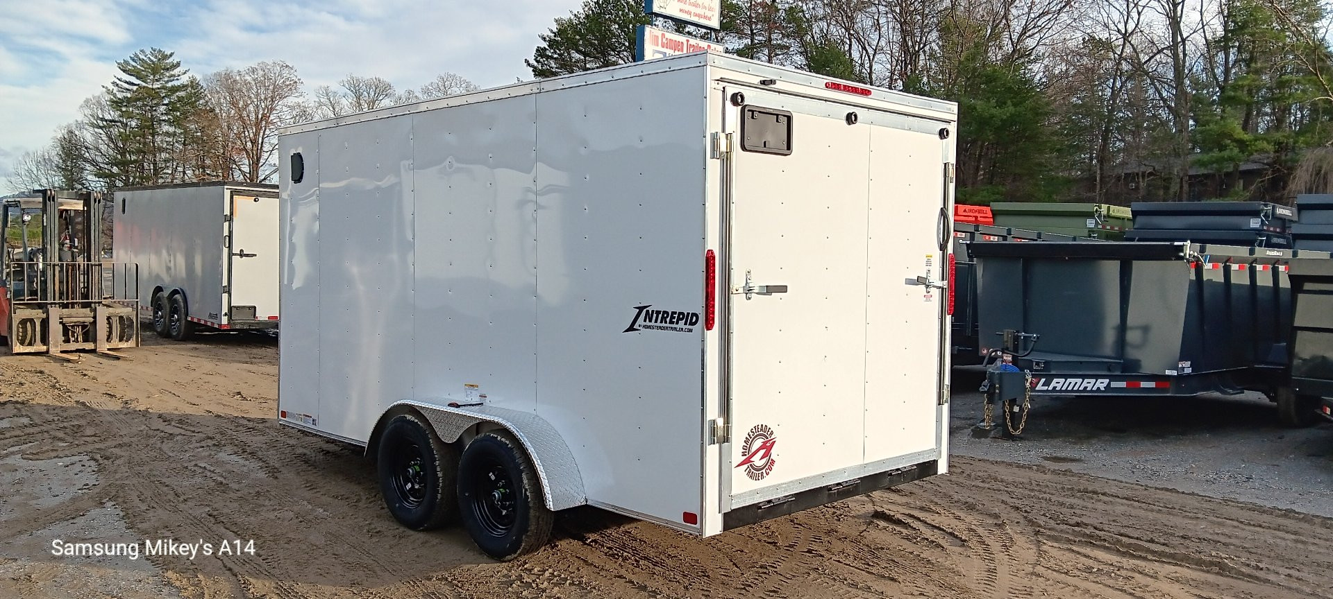 New 2025 Homesteader Trailers / 714IT Intrepid / 6'6" Interior Height / .030 White Aluminum / Ramp Rear Door / 32" Side Door