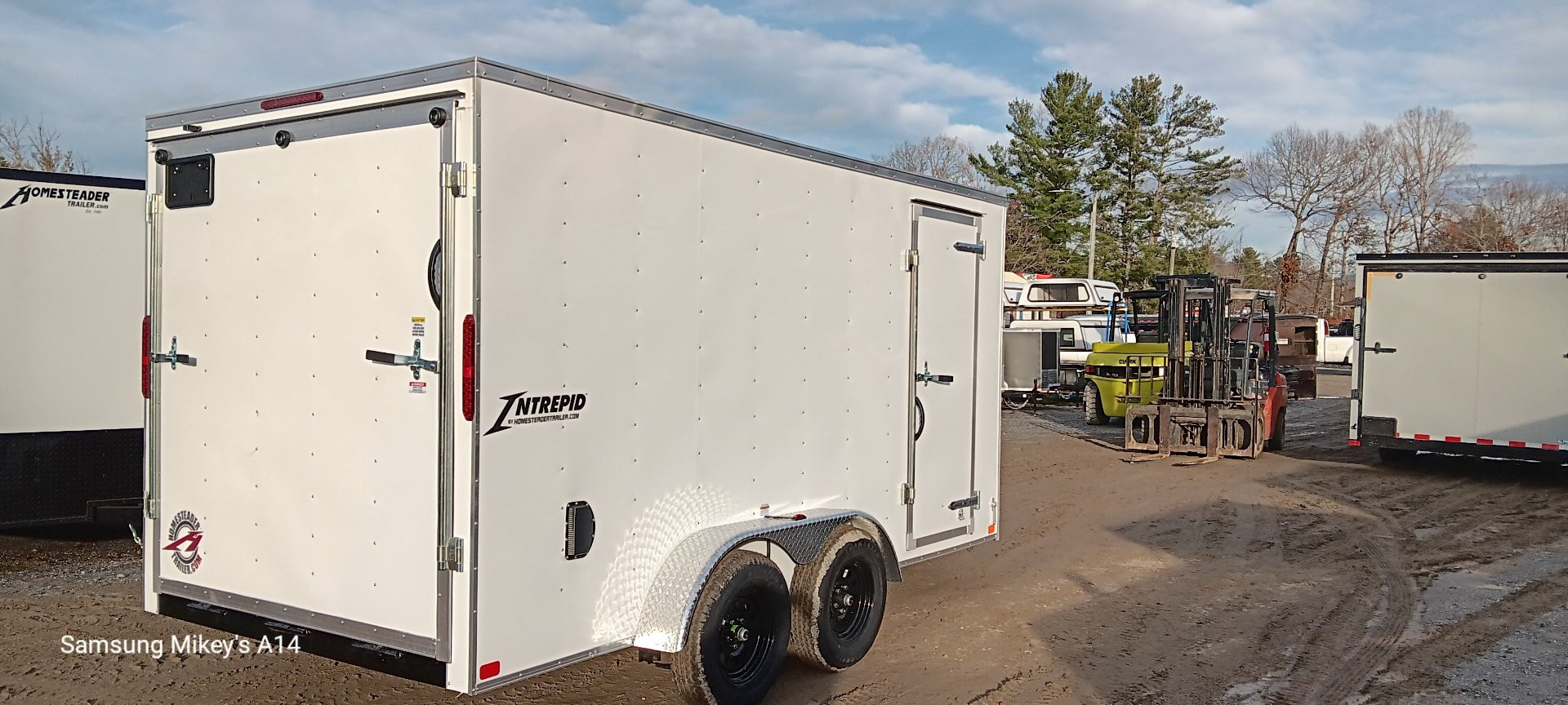 New 2025 Homesteader Trailers / 714IT Intrepid / 6'6" Interior Height / .030 White Aluminum / Ramp Rear Door / 32" Side Door