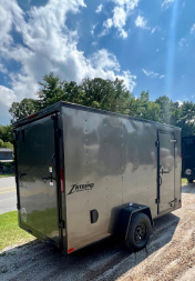 New 2025 HOMESTEADER TRAILER / INTREPID SERIES / 6' WIDE X 12' LONG / 6'6" INTERIOR HEIGHT / .030 CHARCOAL GRAY ALUMINUM W/ BLACK OUT PKG / 32" SIDE DOOR W/ RV LOCK / RAMP REAR DOOR / 4-D RINGS / 16" O/C WALL POST