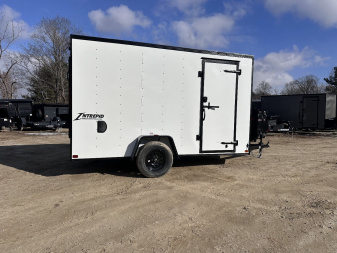 New 2025 HOMESTEADER TRAILER / INTREPID SERIES / 6' WIDE X 12' LONG / 6'6" INTERIOR HEIGHT / WHITE .030 ALUMINUM W/ BLACK OUT PKG / 32" SIDE DOOR W/ RV LOCK / RAMP REAR DOOR / 4-D RINGS / 16" O/C WALL POST