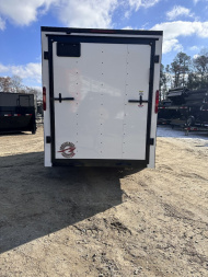 New 2025 HOMESTEADER TRAILER / INTREPID SERIES / 6' WIDE X 12' LONG / 6'6" INTERIOR HEIGHT / WHITE .030 ALUMINUM W/ BLACK OUT PKG / 32" SIDE DOOR W/ RV LOCK / RAMP REAR DOOR / 4-D RINGS / 16" O/C WALL POST