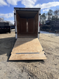 New 2025 HOMESTEADER TRAILER / INTREPID SERIES / 6' WIDE X 12' LONG / 6'6" INTERIOR HEIGHT / WHITE .030 ALUMINUM W/ BLACK OUT PKG / 32" SIDE DOOR W/ RV LOCK / RAMP REAR DOOR / 4-D RINGS / 16" O/C WALL POST