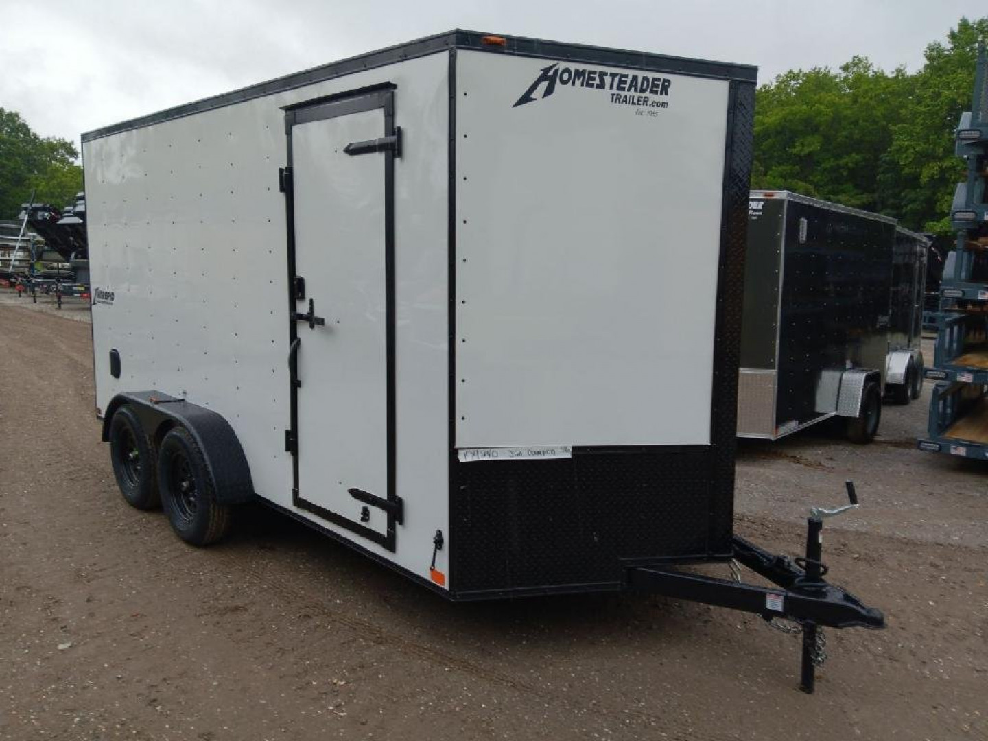 New 2025 Homesteader Trailers / 714IT Intrepid / 7' Interior Height / .030 White Aluminum w/ Black Out Pkg / Ramp Rear Door / 32" Side Door w/ RV Lock / 4-Recessed Floor D-Rings