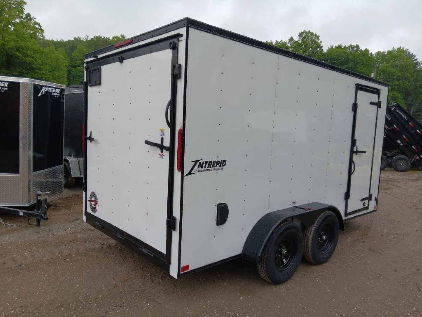 New 2025 Homesteader Trailers / 714IT Intrepid / 7' Interior Height / .030 White Aluminum w/ Black Out Pkg / Ramp Rear Door / 32" Side Door w/ RV Lock / 4-Recessed Floor D-Rings