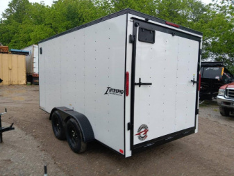New 2025 Homesteader Trailers / 714IT Intrepid / 7' Interior Height / .030 White Aluminum w/ Black Out Pkg / Ramp Rear Door / 32" Side Door w/ RV Lock / 4-Recessed Floor D-Rings