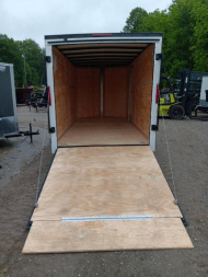 New 2025 Homesteader Trailers / 714IT Intrepid / 7' Interior Height / .030 White Aluminum w/ Black Out Pkg / Ramp Rear Door / 32" Side Door w/ RV Lock / 4-Recessed Floor D-Rings