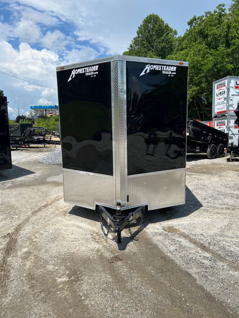 New 2025 HOMESTEADER CARGO TRAILER / INTREPID SERIES / 7'X16' / 7' INTERIOR HEIGHT / 32" SIDE DOOR W/ RV LOCK / RAMPS REAR DOOR / .030 BLACK ALUMINUM