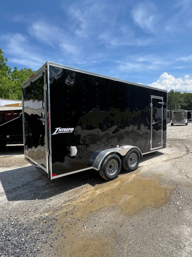New 2025 HOMESTEADER CARGO TRAILER / INTREPID SERIES / 7'X16' / 7' INTERIOR HEIGHT / 32" SIDE DOOR W/ RV LOCK / RAMPS REAR DOOR / .030 BLACK ALUMINUM