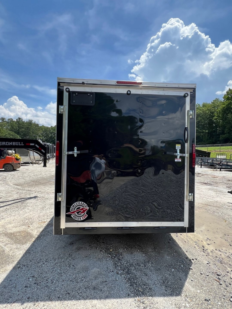 New 2025 HOMESTEADER CARGO TRAILER / INTREPID SERIES / 7'X16' / 7' INTERIOR HEIGHT / 32" SIDE DOOR W/ RV LOCK / RAMPS REAR DOOR / .030 BLACK ALUMINUM
