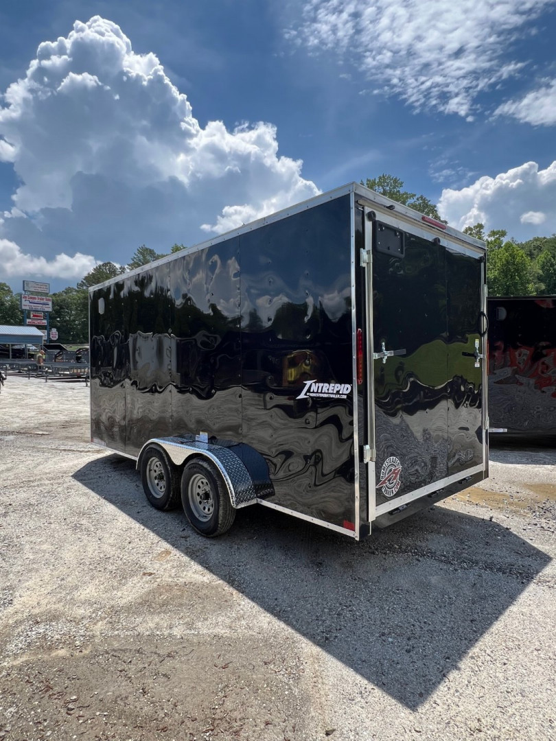 New 2025 HOMESTEADER CARGO TRAILER / INTREPID SERIES / 7'X16' / 7' INTERIOR HEIGHT / 32" SIDE DOOR W/ RV LOCK / RAMPS REAR DOOR / .030 BLACK ALUMINUM