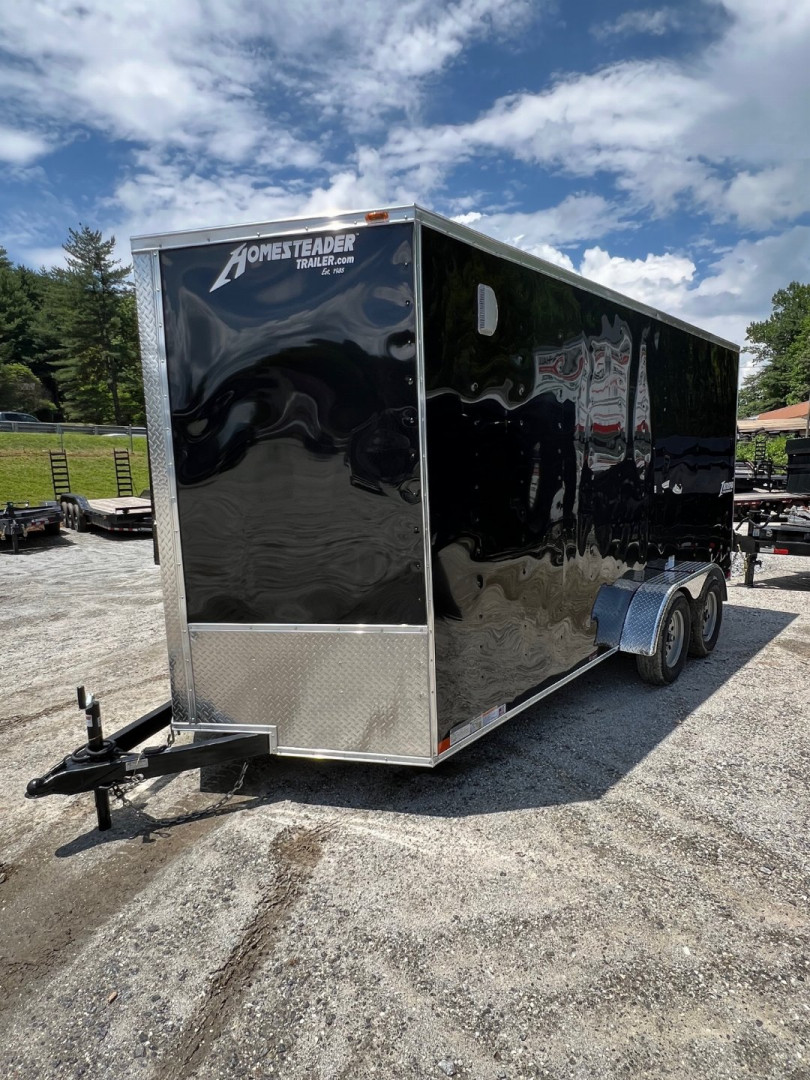 New 2025 HOMESTEADER CARGO TRAILER / INTREPID SERIES / 7'X16' / 7' INTERIOR HEIGHT / 32" SIDE DOOR W/ RV LOCK / RAMPS REAR DOOR / .030 BLACK ALUMINUM