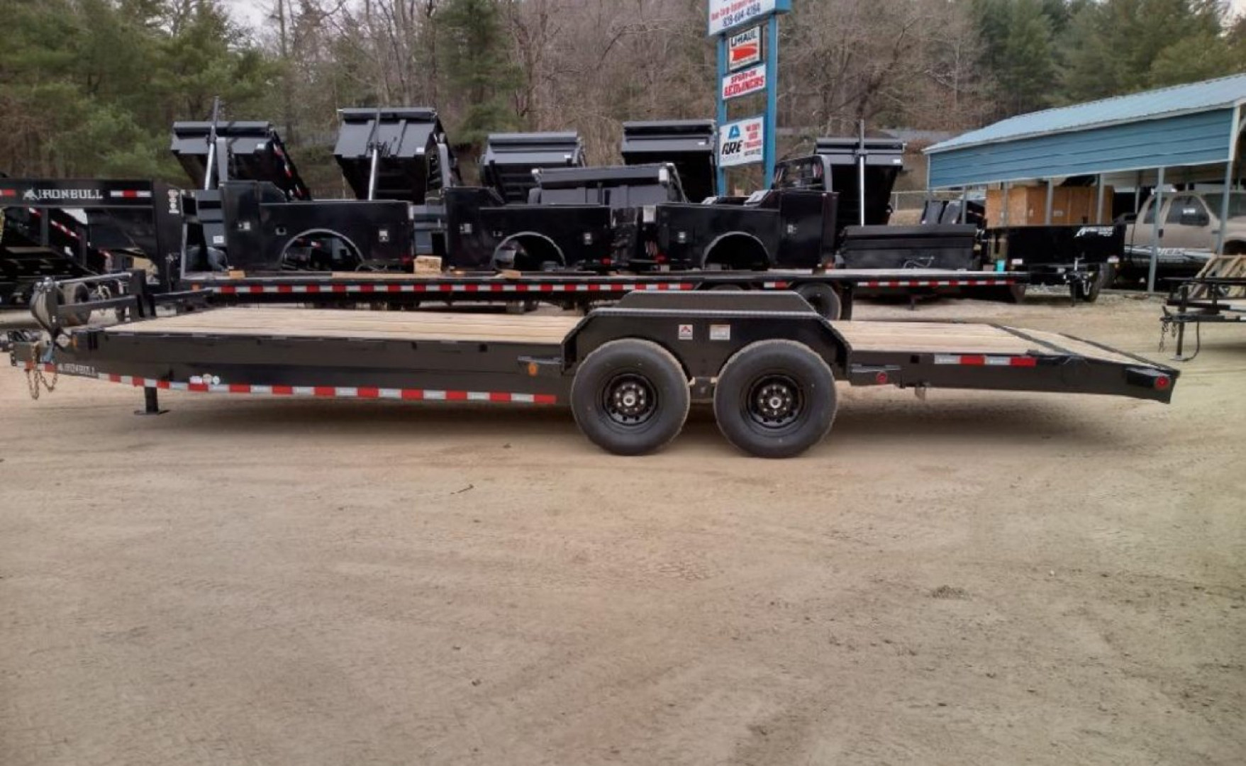 New 2023 IRON BULL ETB Series / 83" Wide x 24' Long / 2-7,000# Electric Brake Axles / Slide In Ramps / Wood Floor