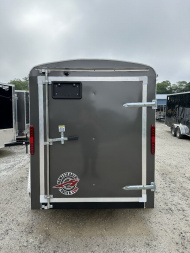 New 2025 Homesteader Trailer / Challenger Series / 5x8 / 5'7" Interior Height / Single Swing Rear Door / 32" Side Door / 24" Stoneguard / .030 Charcoal Gray Aluminum