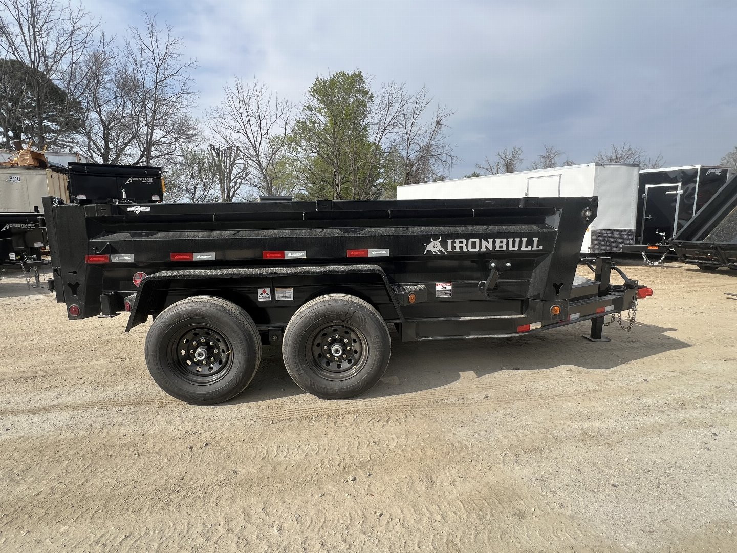 New 2024 Iron Bull DumpTrailers / DTB Series / 72" Wide x 12' Long / Scissor Hoist / 2-5200 # Electric Brake Axles / 24" High Sides / Combo Rear Gate / Tarp System