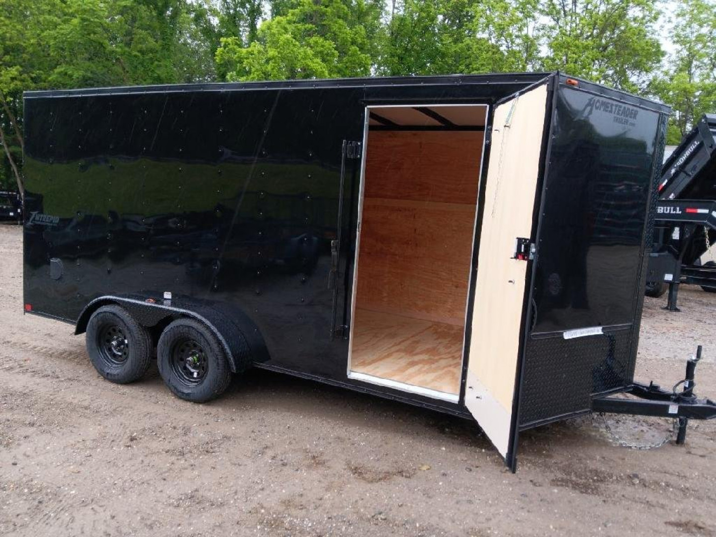 New 2025 Homesteader Trailers / 716IT Intrepid / 7' Interior Height / .030 Black Aluminum w/ Black Out Pkg / Ramp Rear Door / 32" Side Door w/ RV Lock/ 4 Recessed Floor D-Rings