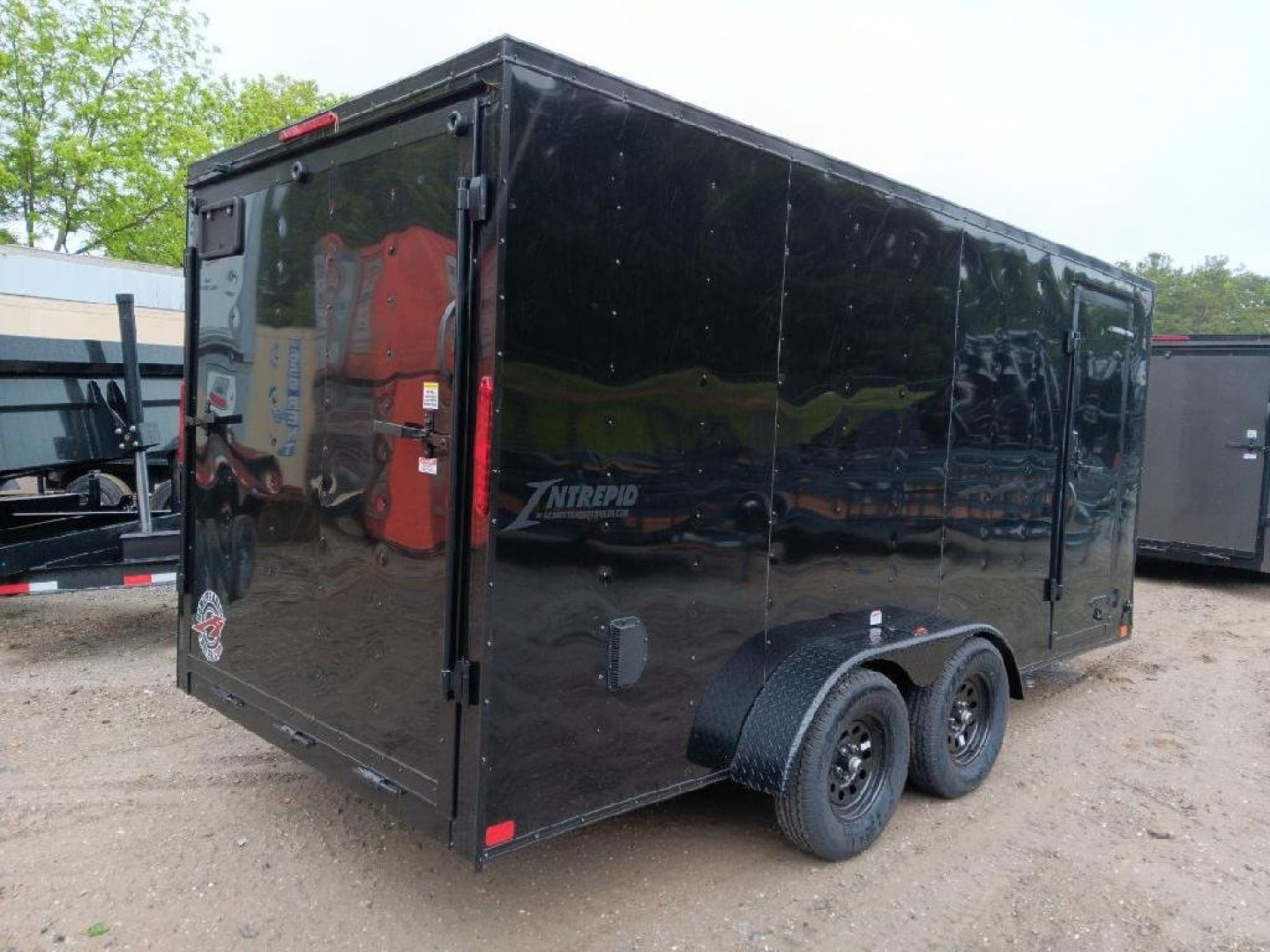 New 2025 Homesteader Trailers / 716IT Intrepid / 7' Interior Height / .030 Black Aluminum w/ Black Out Pkg / Ramp Rear Door / 32" Side Door w/ RV Lock/ 4 Recessed Floor D-Rings