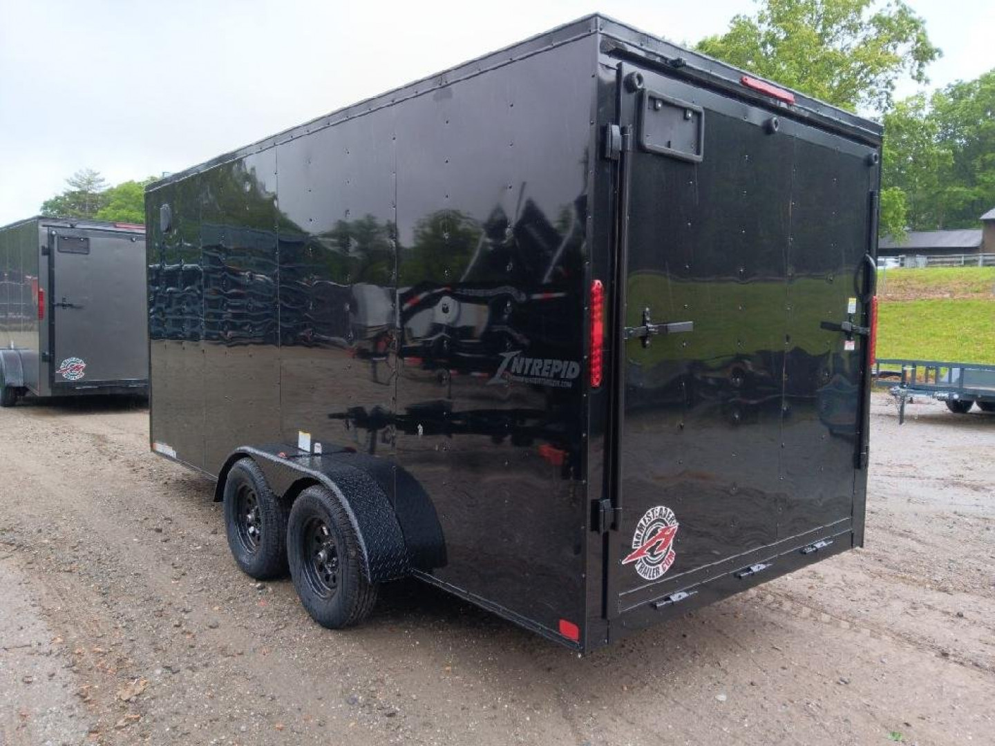 New 2025 Homesteader Trailers / 716IT Intrepid / 7' Interior Height / .030 Black Aluminum w/ Black Out Pkg / Ramp Rear Door / 32" Side Door w/ RV Lock/ 4 Recessed Floor D-Rings
