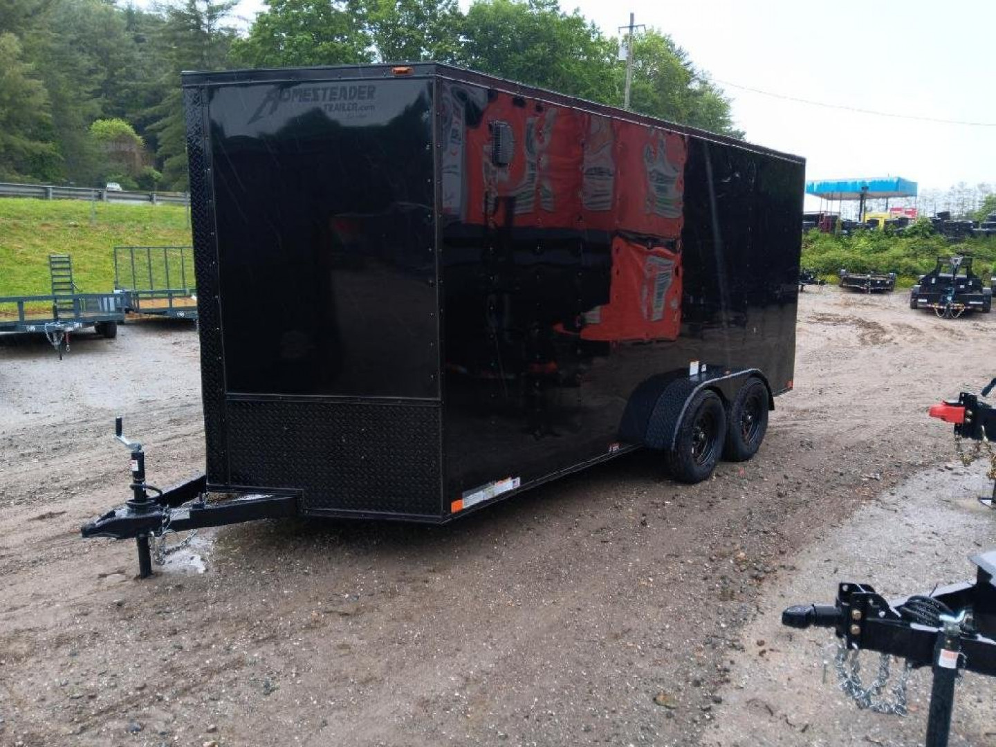 New 2025 Homesteader Trailers / 716IT Intrepid / 7' Interior Height / .030 Black Aluminum w/ Black Out Pkg / Ramp Rear Door / 32" Side Door w/ RV Lock/ 4 Recessed Floor D-Rings