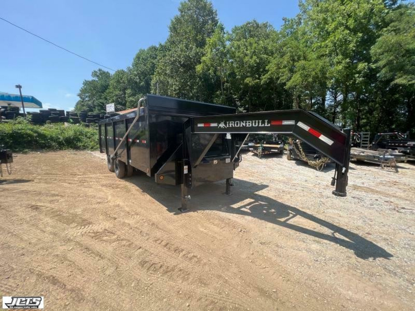 New 2023 Iron Bull DMG Series / 102" Wide x 20' Long / 4' High Sides / Barn Door Gates / 2-10,000# Axles / Black In color / Telescopic Hoist / Side Arm Tarp System