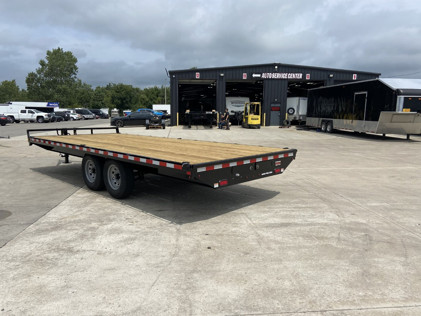 New Sure-Trac 8.5x20 Flat Deckover Trailer with slide in ramps