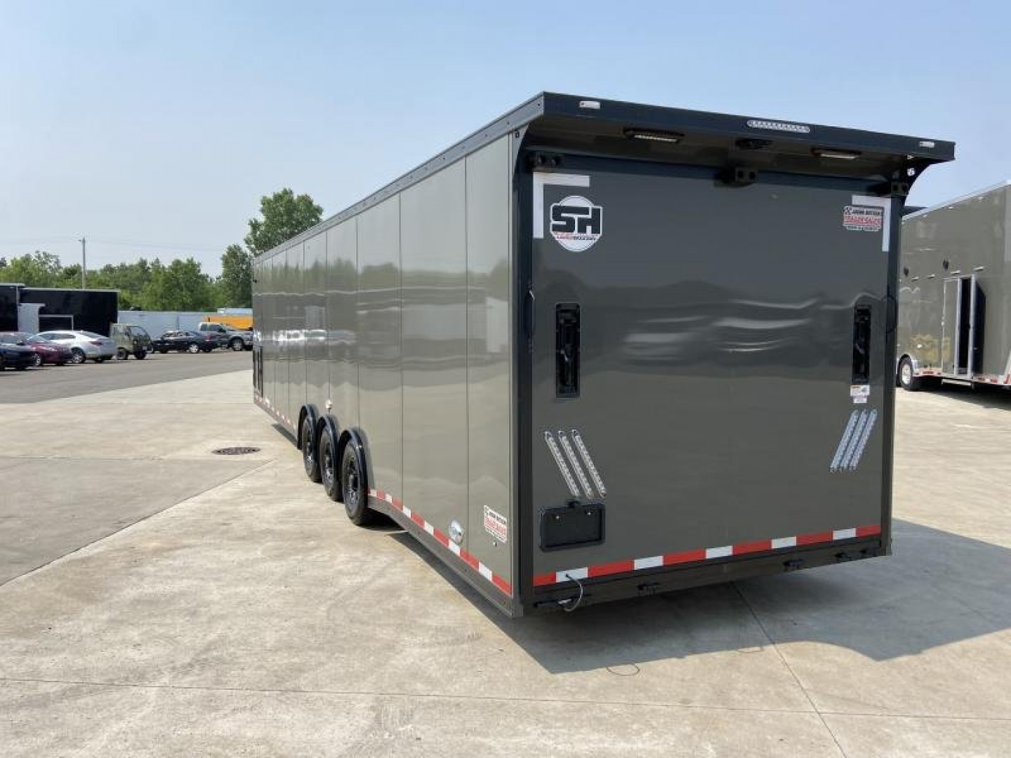 New 34' Car Hauler/Racing Trailer (110V Package & Cabinets) - United Super Hauler