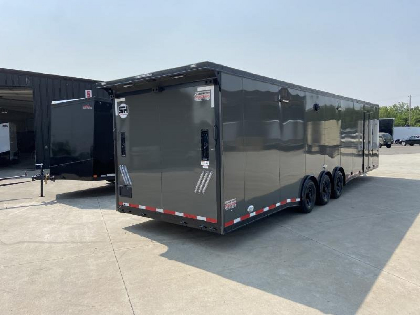 New 34' Car Hauler/Racing Trailer (110V Package & Cabinets) - United Super Hauler