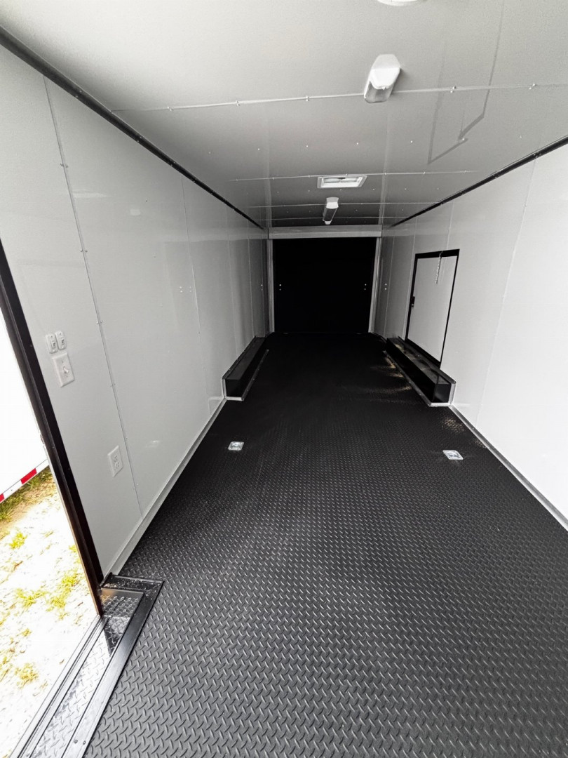 New 2025 8.5X28' RACE TRAILER-ESCAPE DOOR-BLACK OUT TRIM-7' INTERIOR-ELECTRIC JACK-WING-LOADING LIGHTS-GEN COMPARTMENT-MUCH MORE Car / Racing Trailer