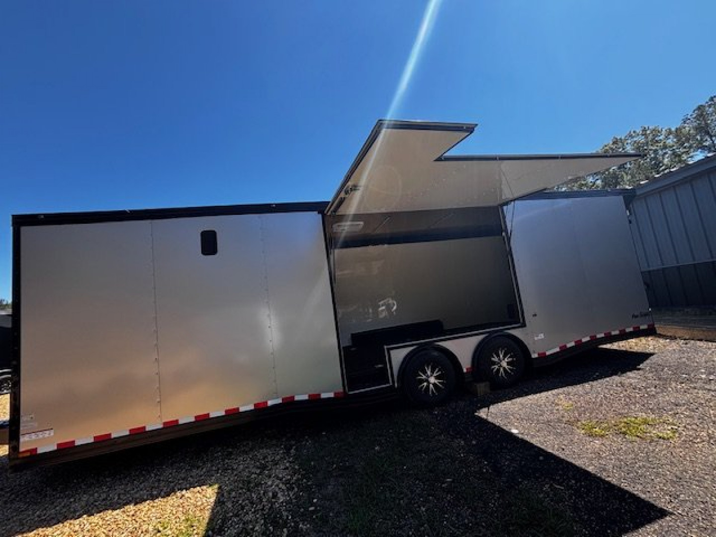 New 2025 8.5X28 RACE TRAILER-ESC DOOR-90" INTERIOR HEIGHT-CABINETS-A/C-SPIDER MAG WHEELS-REAR WING-BLACKOUT TRIM-MUCH MORE Car / Racing Trailer