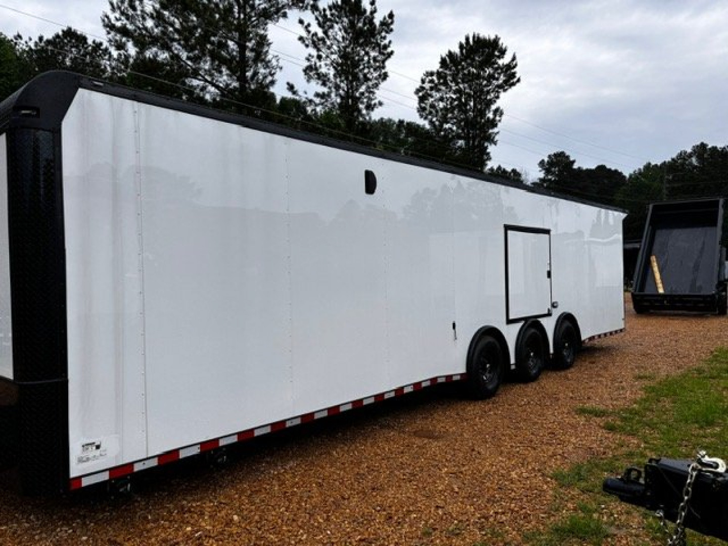 New 2025 8.5X34' BATHROOM RACE TRAILER -BLACKOUT TRIM-ESCAPE DOOR-TRIPLE AXLE-7' INTERIOR HEIGHT-CABINETS Car / Racing Trailer