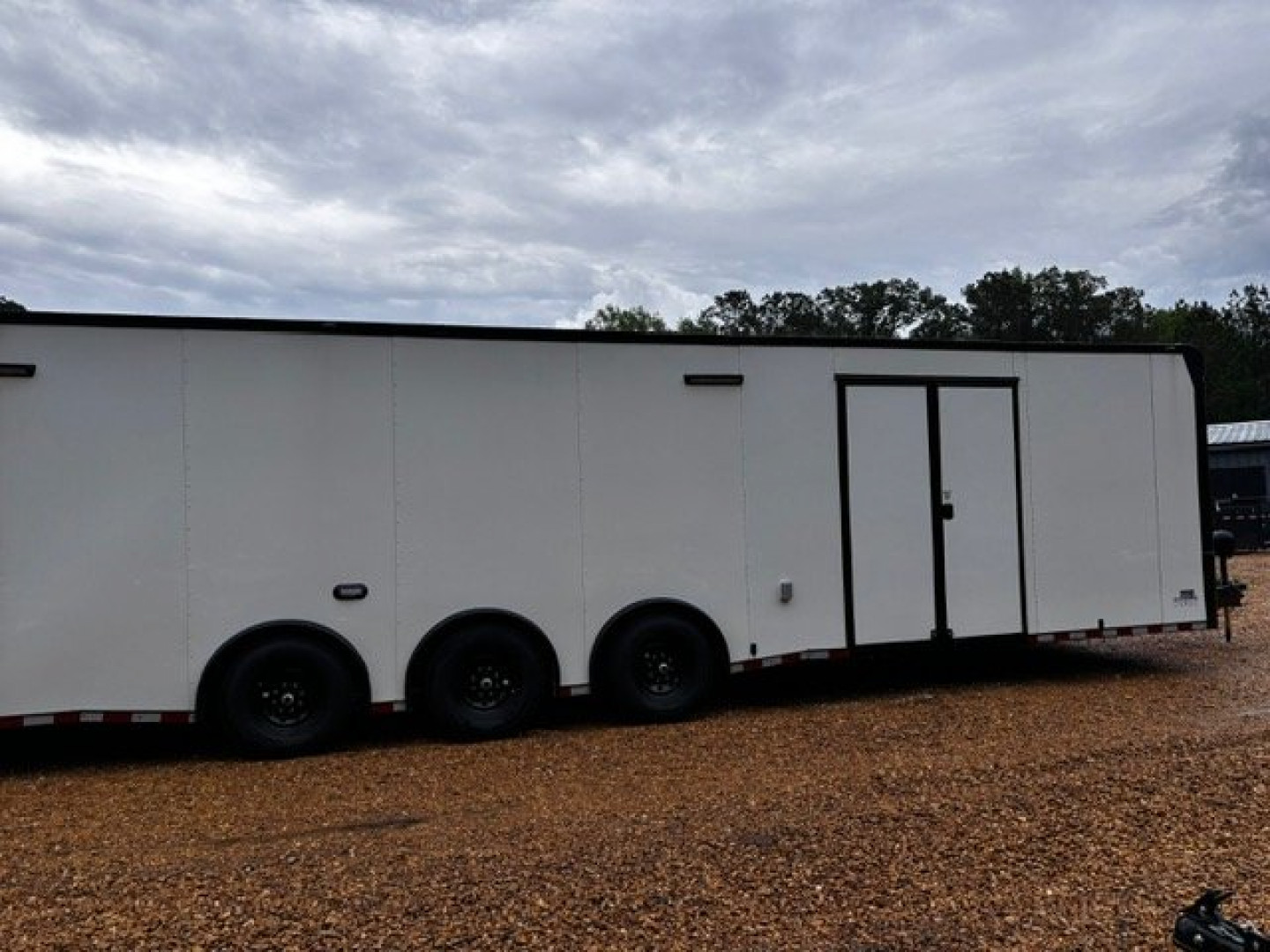 New 2025 8.5X34' BATHROOM RACE TRAILER -BLACKOUT TRIM-ESCAPE DOOR-TRIPLE AXLE-7' INTERIOR HEIGHT-CABINETS Car / Racing Trailer