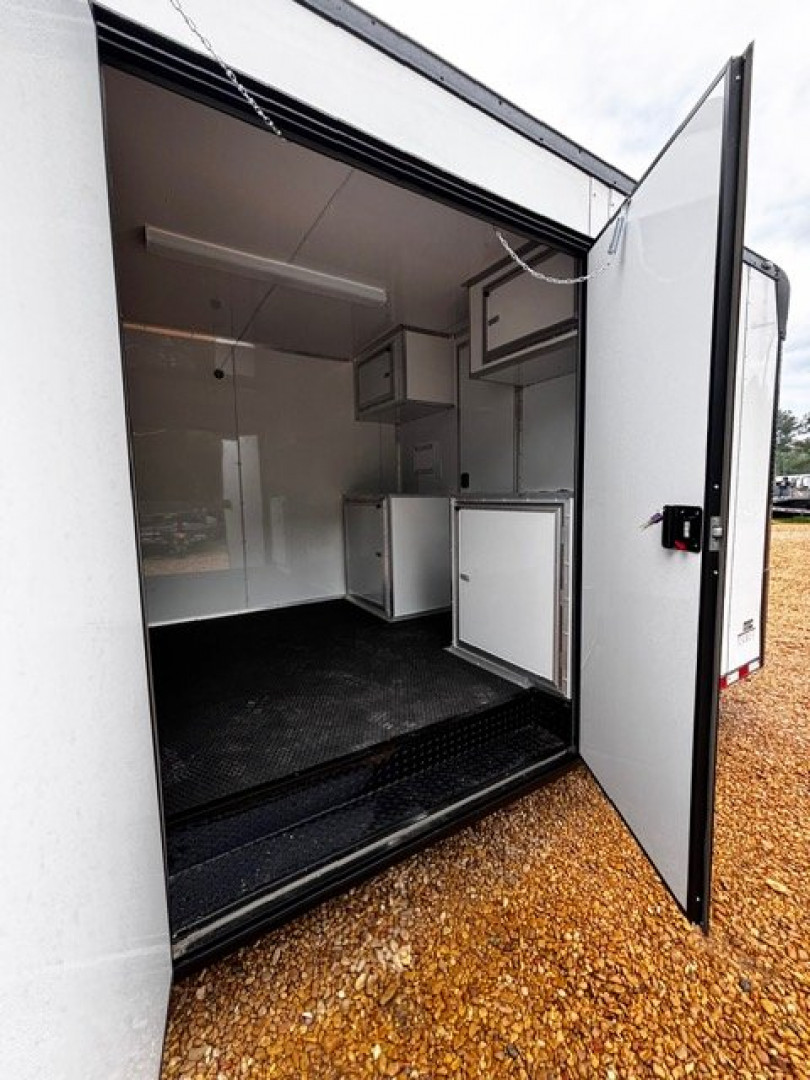 New 2025 8.5X34' BATHROOM RACE TRAILER -BLACKOUT TRIM-ESCAPE DOOR-TRIPLE AXLE-7' INTERIOR HEIGHT-CABINETS Car / Racing Trailer